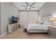 Main bedroom with a king-size bed, wood floors, and a ceiling fan at 11457 E Blanche Dr, Scottsdale, AZ 85255