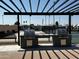 Outdoor community grills with pergola cover, picnic tables, and nearby tennis area at 2701 E Allred Ave # 68, Mesa, AZ 85204