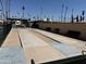 Well maintained shuffleboard court with benches and a surrounding fence at 2701 E Allred Ave # 68, Mesa, AZ 85204
