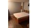 Bright bedroom featuring a comfortable bed and wood flooring at 2701 E Allred Ave # 68, Mesa, AZ 85204