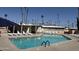 Refreshing community pool with plenty of lounge chairs at 2701 E Allred Ave # 68, Mesa, AZ 85204