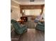 Cozy living room with wood-paneled walls and comfy armchairs at 2701 E Allred Ave # 68, Mesa, AZ 85204