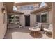 Cozy courtyard with seating area and fire pit at 10005 W Spur Dr, Peoria, AZ 85383