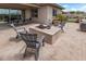 Relaxing fire pit area on the patio at 10005 W Spur Dr, Peoria, AZ 85383