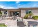 Spacious backyard patio with fire pit and seating at 10005 W Spur Dr, Peoria, AZ 85383