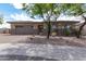 One-story home with a two-car garage and landscaped yard at 10005 W Spur Dr, Peoria, AZ 85383