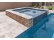 Relaxing spa with water feature adjacent to pool at 10005 W Spur Dr, Peoria, AZ 85383