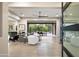 Bright and airy living room with hardwood floors and access to the backyard at 8742 E Woodley Way, Scottsdale, AZ 85266