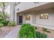 Condo building exterior with landscaping and walkway at 7710 E Gainey Ranch Rd # 133, Scottsdale, AZ 85258