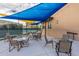 Outdoor patio area with seating and shade structures at 7710 E Gainey Ranch Rd # 133, Scottsdale, AZ 85258