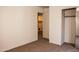 Bedroom with carpet flooring and access to closet and bathroom at 9419 W Sheridan St, Phoenix, AZ 85037
