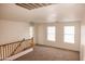 Bright bonus room with carpet and two windows at 9419 W Sheridan St, Phoenix, AZ 85037