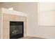 Cozy fireplace with tile surround in living room at 9419 W Sheridan St, Phoenix, AZ 85037