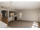 Spacious living room with a fireplace and large windows at 9419 W Sheridan St, Phoenix, AZ 85037