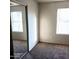 Bright bedroom with mirrored closet and carpet at 9419 W Sheridan St, Phoenix, AZ 85037