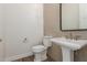 Stylish powder room with pedestal sink and neutral tile at 1606 E Minton St, Mesa, AZ 85203