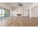 Bright living room with a modern fireplace and sliding glass doors leading to the patio at 1606 E Minton St, Mesa, AZ 85203