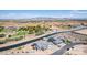 Aerial view showcasing two houses near a canal with distant mountain views at 1606 E Minton St, Mesa, AZ 85203