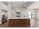 Modern kitchen with white cabinetry, a large island, and stainless steel appliances at 1606 E Minton St, Mesa, AZ 85203