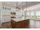 Modern kitchen with white cabinetry, a large island, and stainless steel appliances at 1606 E Minton St, Mesa, AZ 85203