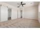 Bright bedroom with a barn door and access to the bathroom at 1606 E Minton St, Mesa, AZ 85203