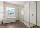 Spa-like bathroom featuring a soaking tub and a walk-in shower at 1606 E Minton St, Mesa, AZ 85203
