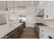 Modern kitchen with white cabinetry, stainless steel appliances, and a large island at 1606 E Minton St, Mesa, AZ 85203