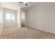 Bright bedroom with carpet flooring and an ensuite bathroom at 1606 E Minton St, Mesa, AZ 85203