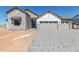 Two-story home with a three-car garage and stone accents at 1606 E Minton St, Mesa, AZ 85203