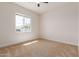Well-lit bedroom featuring carpet flooring and a window with natural light at 1606 E Minton St, Mesa, AZ 85203