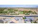 Aerial view of two houses near a canal, highlighting the waterfront location and community setting at 1606 E Minton St, Mesa, AZ 85203
