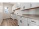 Bright laundry room with ample cabinet space and countertop at 1606 E Minton St, Mesa, AZ 85203