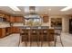 Modern kitchen with granite island, stainless steel appliances, and ample cabinetry at 6023 E Turquoise Ave, Paradise Valley, AZ 85253