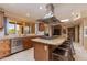 Gourmet kitchen boasts granite countertops, stainless steel appliances, and large island at 6023 E Turquoise Ave, Paradise Valley, AZ 85253