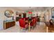 Elegant dining room with a large table and red velvet chairs at 6023 E Turquoise Ave, Paradise Valley, AZ 85253