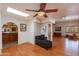 Bright bedroom with hardwood floors, ceiling fan, and access to patio at 6023 E Turquoise Ave, Paradise Valley, AZ 85253