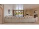 Spacious living room with large sectional sofa, fireplace, and view of backyard at 6023 E Turquoise Ave, Paradise Valley, AZ 85253