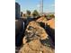 View of new construction home with landscaping and utilities at 22205 W Ocupado Dr, Wittmann, AZ 85361