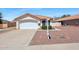 Tan house with tile roof, single car garage, and small front yard at 6602 E Northridge St, Mesa, AZ 85215