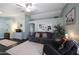 Living room with gray couch, dark floors, and a window seat at 6602 E Northridge St, Mesa, AZ 85215