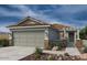 One-story home with a two-car garage and Spanish-style tile roof at 18485 N Tanners Way, Maricopa, AZ 85138