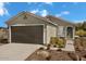 Single-story home with two-car garage and landscaping at 18495 N Tanners Way, Maricopa, AZ 85138