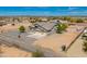 Aerial view of the house and surrounding property showing the layout and desert setting at 23612 W Beacon Ln, Wittmann, AZ 85361