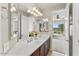 Bathroom with double vanity, large mirror, and a view at 23612 W Beacon Ln, Wittmann, AZ 85361