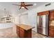 Kitchen boasts granite countertops, wood cabinets, and an island at 2242 W Myrtle Dr, Chandler, AZ 85248