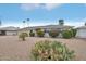 Single story home with desert landscaping at 17622 N Whispering Oaks Dr, Sun City West, AZ 85375