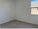 Spacious bedroom with gray carpet and a window at 5537 W Paseo Way, Laveen, AZ 85339