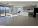 Modern kitchen with gray cabinets, island, and tile floors at 5537 W Paseo Way, Laveen, AZ 85339