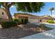 House exterior with landscaping and a two-car garage at 14623 W Hearn Rd, Surprise, AZ 85379