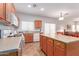 Well-equipped kitchen boasts ample cabinetry and an island at 14623 W Hearn Rd, Surprise, AZ 85379